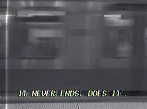 a passing train in grainy black and white, captioned it never ends, does it.
